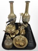 A group of brass items including pair of embossed vases, teapot, candlesticks, oil can, etc.
