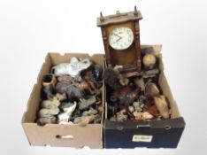 A group of elephant ornaments including carved wooden examples, pair of globe bookends, wall clock,