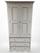 A French style painted pine wardrobe,