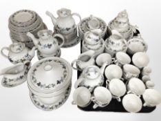 Approximately 150 pieces of Royal Doulton Burgundy tea and dinner porcelain.