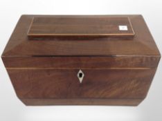 A mahogany sarcophagus tea caddy with two-division interior, width 23cm.
