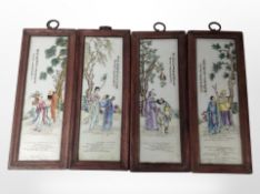 A set of four 20th-century Chinese rectangular porcelain plaques in wooden frames,