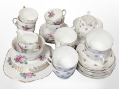 A group of Heathcoat and Regency tea china decorated with roses.