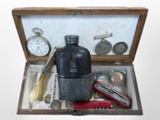 An oak box containing hip flask, Swiss army knives, carved horn spoons, pocket watch,