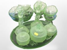 A group of Art Deco green glass dressing table pieces including pair of candlesticks,