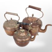 Three Victorian copper kettles, tallest 28cm.