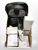 A group of home electricals, hand-held vacuum cleaner, boxed angle-poise lamps, massage cushion,