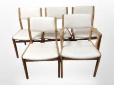 A set of five 20th-century cream vinyl upholstered dining chairs.