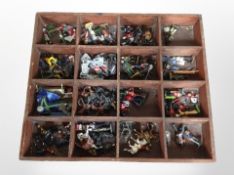 A wooden tray containing assorted die-cast soldiers and similar figures including Del Prado