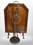 An Edwardian mahogany fire screen and a companion set