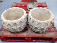 A pair of concrete 'pineapple' planters, height 37cm.