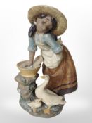 A Lladró bisque figure of a girl and two ducks, height 24cm.
