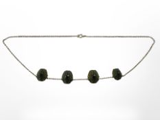 An antique gold mounted scarab beetle necklace, length 40cm.