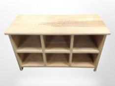 A contemporary pine low storage table,