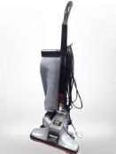 A Kirby upright vacuum cleaner.