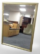 A contemporary bevelled overmantle mirror, 110cm x 84cm.