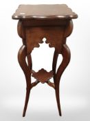 A reproduction stained oak plant stand,