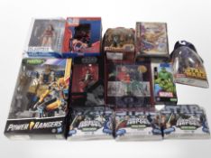 12 Hasbro and other figurines including Star Wars, Power Rangers, DC, etc., boxed.