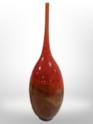 A tall mouth-blown art glass vase with flecked orange and brown decoration, height 46cm.