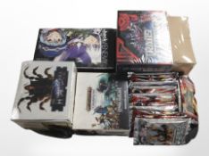 A group of trading cards to include Transformers, Warhammer, The Heaven's Will.