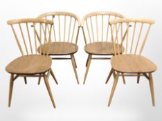 Two pairs of Ercol stained elm and beech spindle back dining chairs