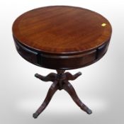 A reproduction mahogany drum table, height 58cm.