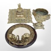 An ornate cast-brass desk stand containing crystal inkwell,