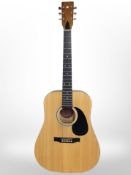 An Encore acoustic guitar.