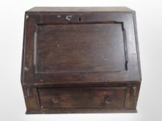 An early-19th century oak writing slope, width 55cm (af).