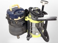 A Ryobi wet and dry vacuum, a further Pro workshop vacuum, and a hosepipe on reel.