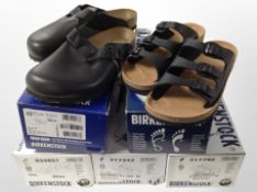 Several pairs of lady's trainers and other shoes.