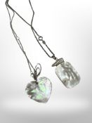 A heart-shaped mother of pearl silver pendant on chain,