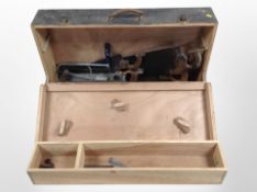 A vintage joiner's toolbox and contents to include several handsaws.