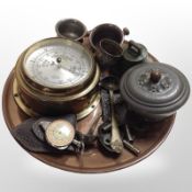A grop of metal wares including continental brass ship's-style barometer, circular copper tray,