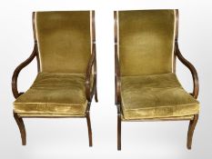 A pair of Regency-style chairs upholstered in green fabric.