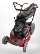 A Garden Care petrol lawn mower with Briggs & Stratton engine.