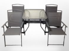 A contemporary metal and glass square patio table with parasol,