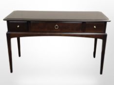 A Stag three-drawer side table, 120cm wide x 47cm deep x 72cm high.