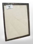 A silver rectangular photograph frame, Birmingham marks 1914, 17cm x 22cm.
