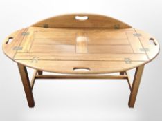 An oak butler's tray table, width 120cm.