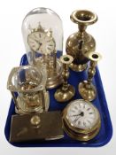 A Hermle quartz mantle timepiece under glass dome, a further timepiece with skeletonised movement,