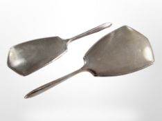 A silver-mounted dressing table hand mirror and brush, Brimingham marks, longest 28cm.