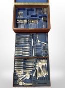 A mahogany canteen containing community plate cutlery.