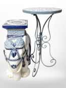 A glazed ceramic elephant plant stand, height 43cm, together with a wrought-metal circular table.