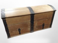 A 19th-century Scandinavian oak and iron-bound dome-topped blanket chest, with key,