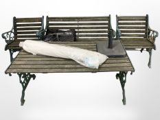A painted cast-iron and teak garden patio set comprising of rectangular table, double bench,