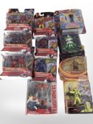 11 Hasbro and other figurines including Transformers, Iron Man, Indiana Jones, etc.