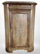 A 19th-century continental flame mahogany corner cabinet, height 143cm.