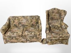 A 20th-century floral two-seater settee with matching wing chair, width 134cm.