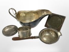 A small group of silver items to include sauce boat, a silver-mounted photograph frame, a compact,